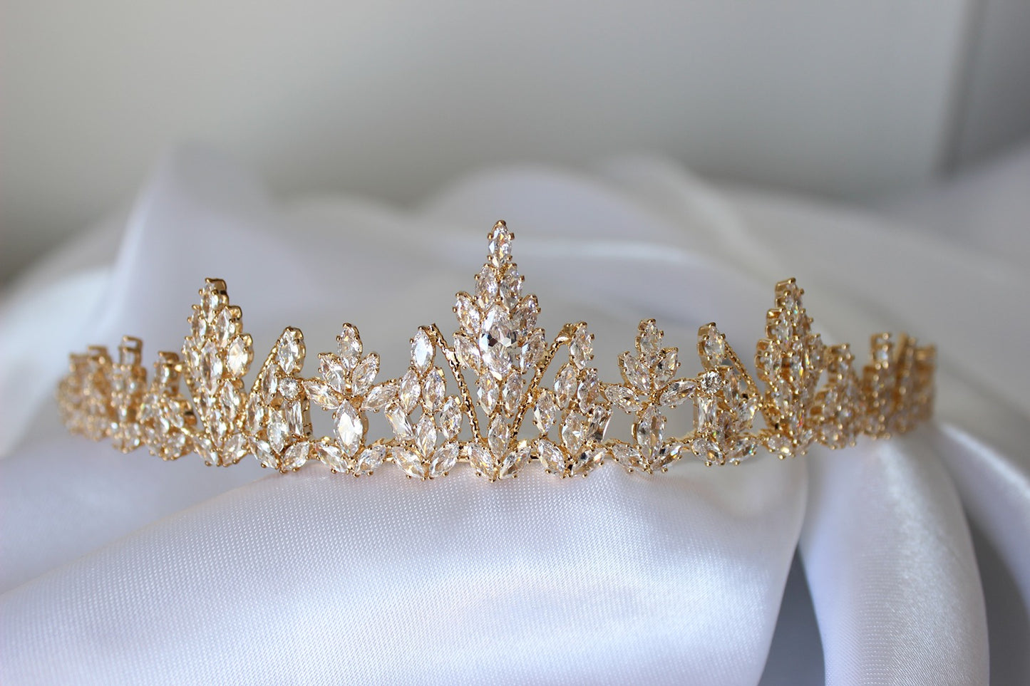 Gold bridal crown on white background