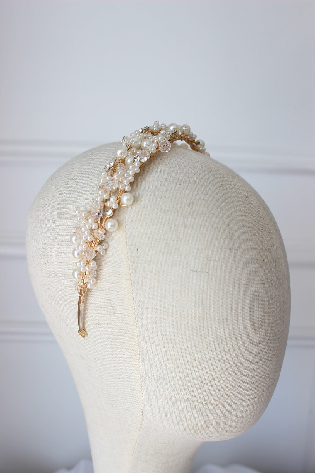Gold bridal headband on mannequin