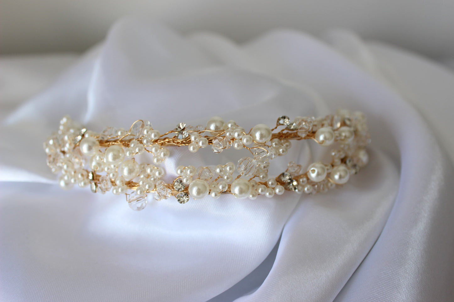 Gold bridal headband on white background