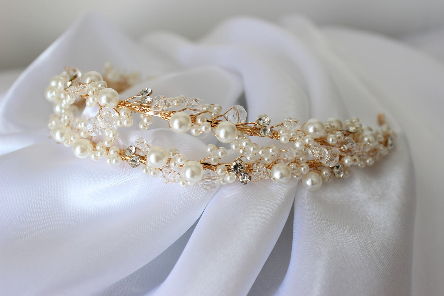 Gold bridal headband on white background