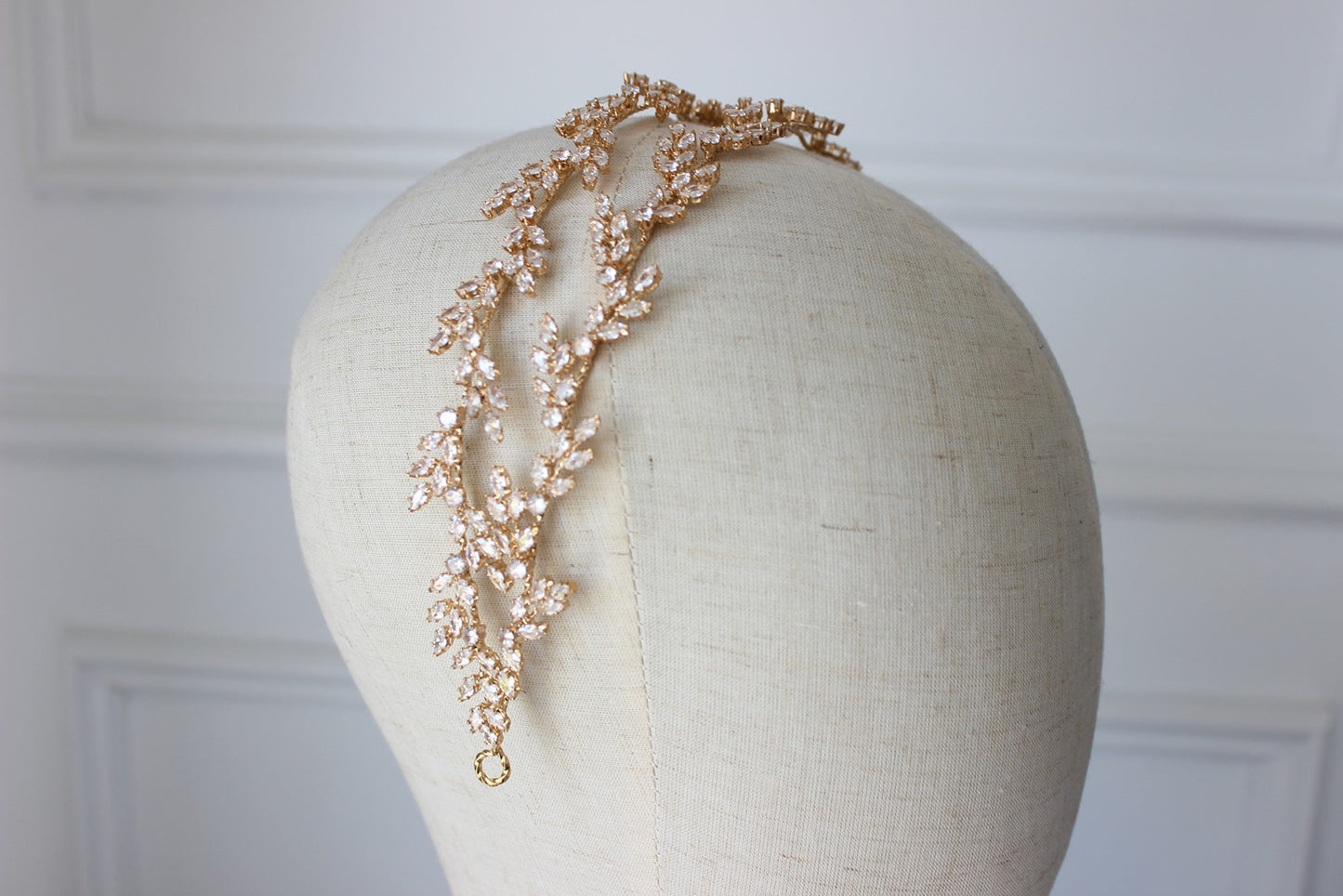 Gold bridal headpiece on white background
