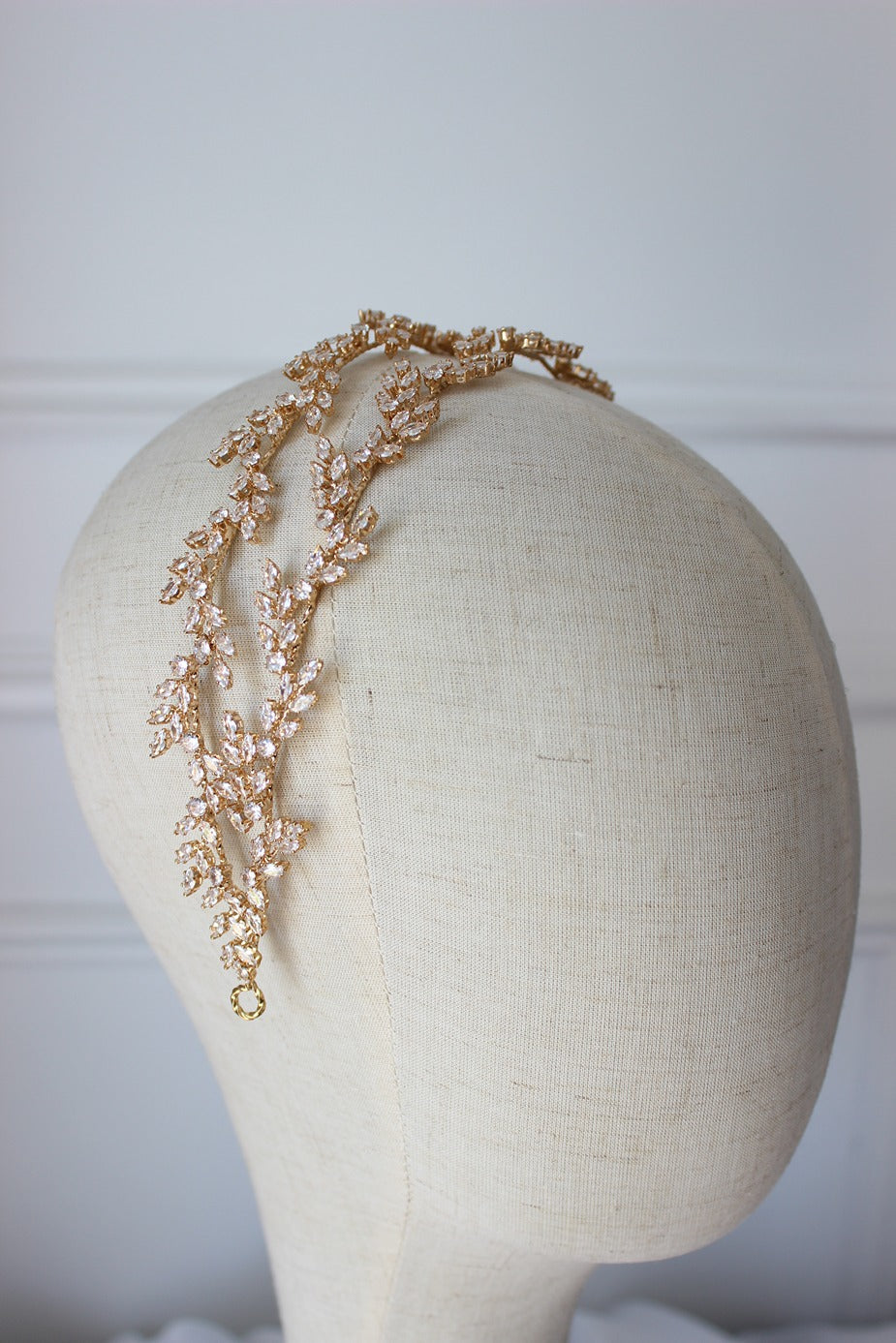 Gold bridal headpiece on white background