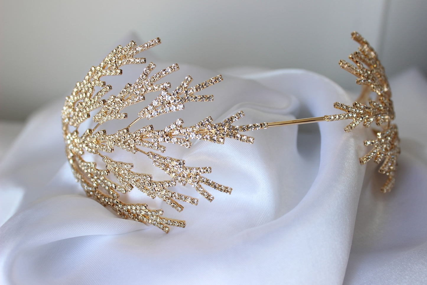 Gold bridal headpiece on white background