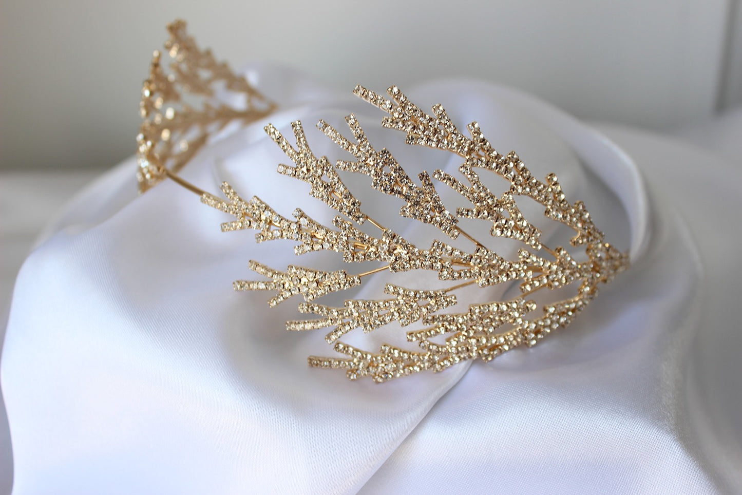 Gold bridal headpiece on white background