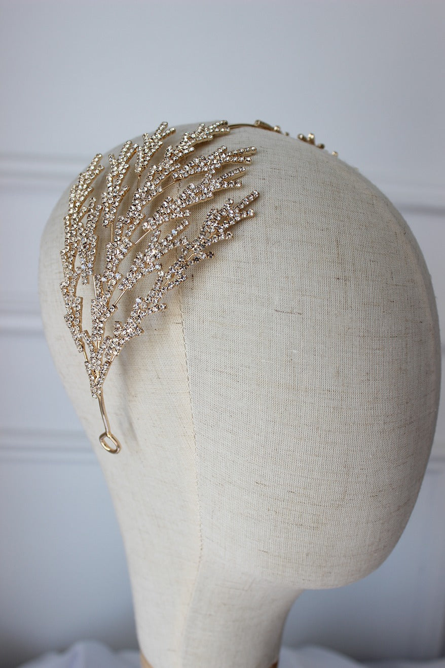 Gold bridal headpiece on mannequin