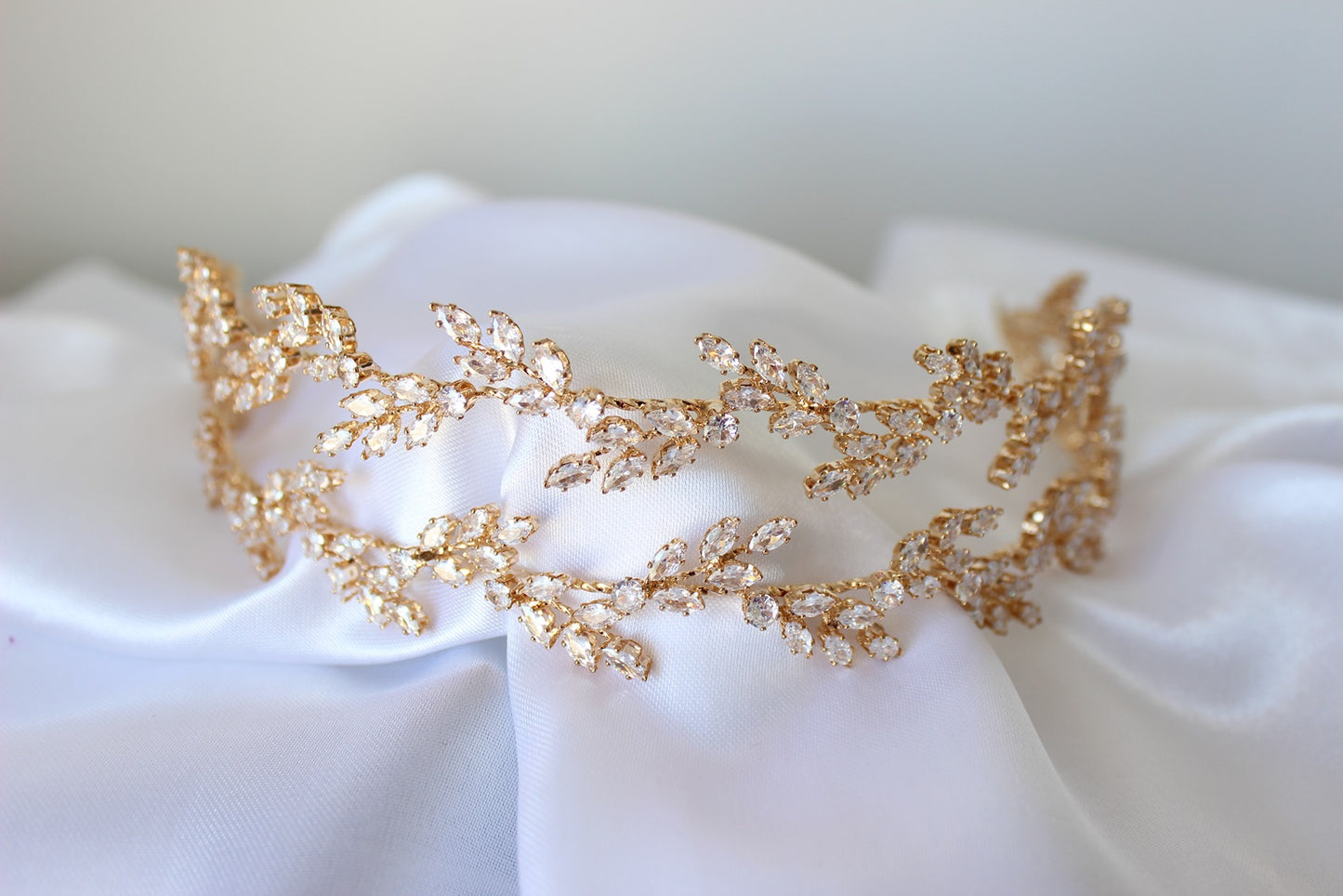 Gold bridal headpiece on white background