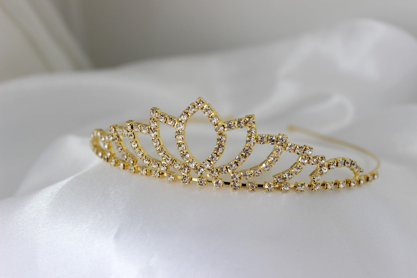Gold flowergirl tiara on white background
