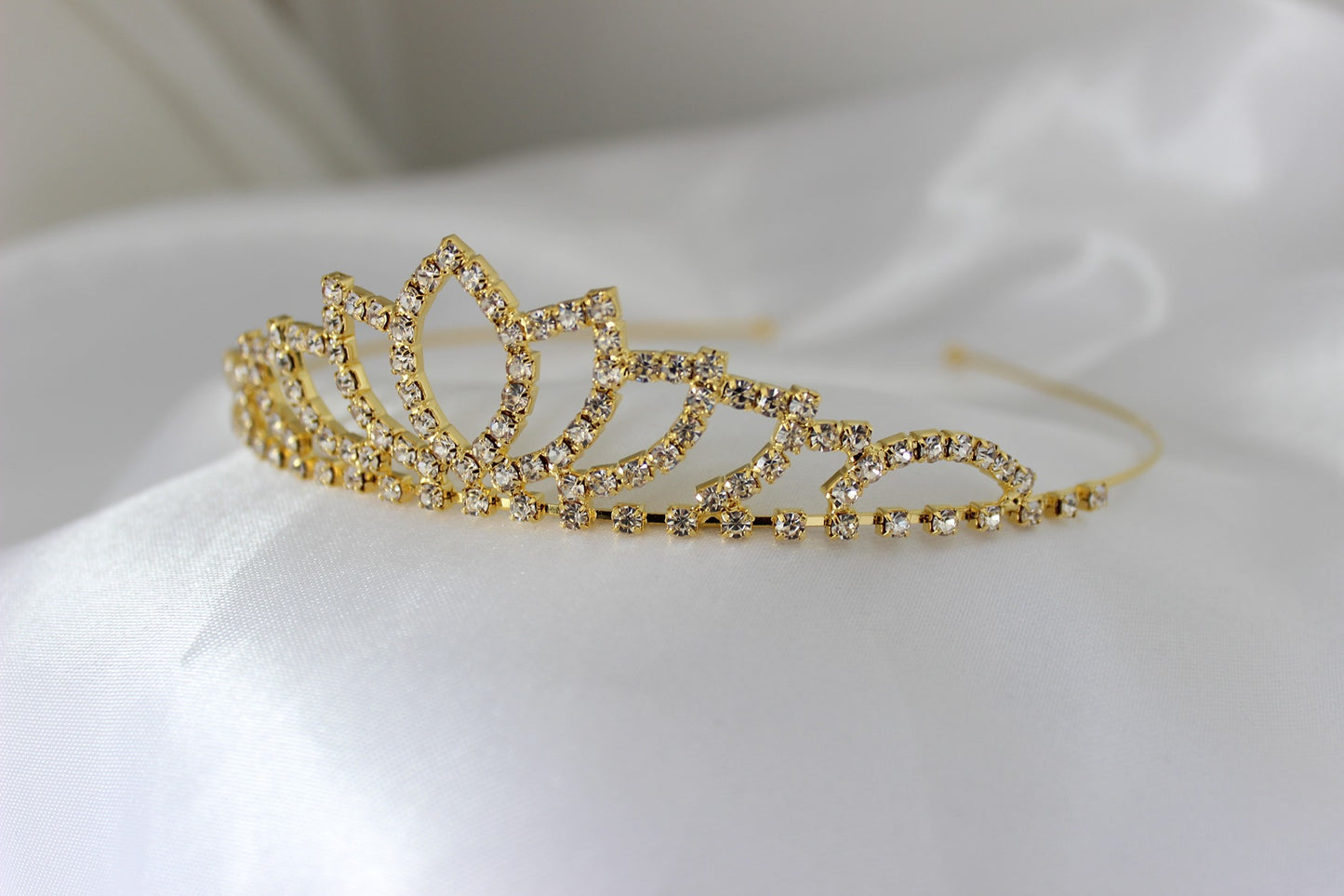 Gold flowergirl tiara on white background