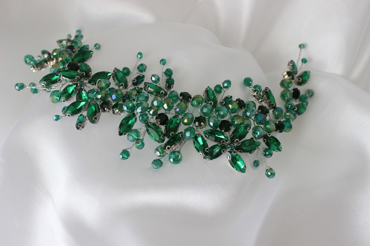 Green bridal headpiece on white background