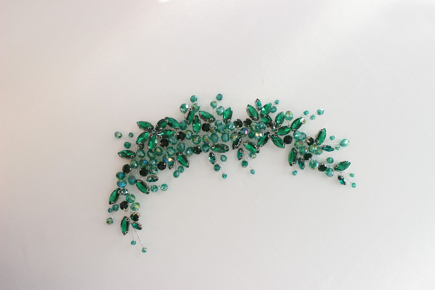 Green bridal headpiece on white background
