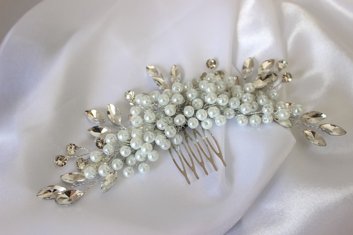 Silver and pearl hair pinon white background