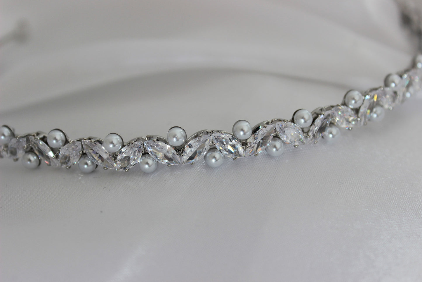 Pearl silver headband on white background