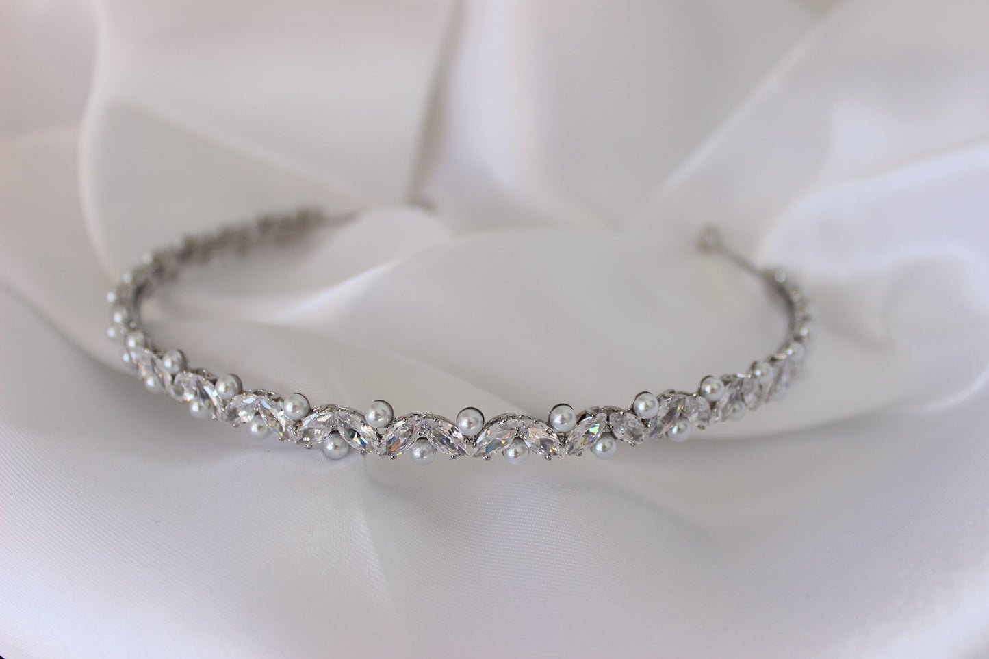 Pearl silver headband on white background