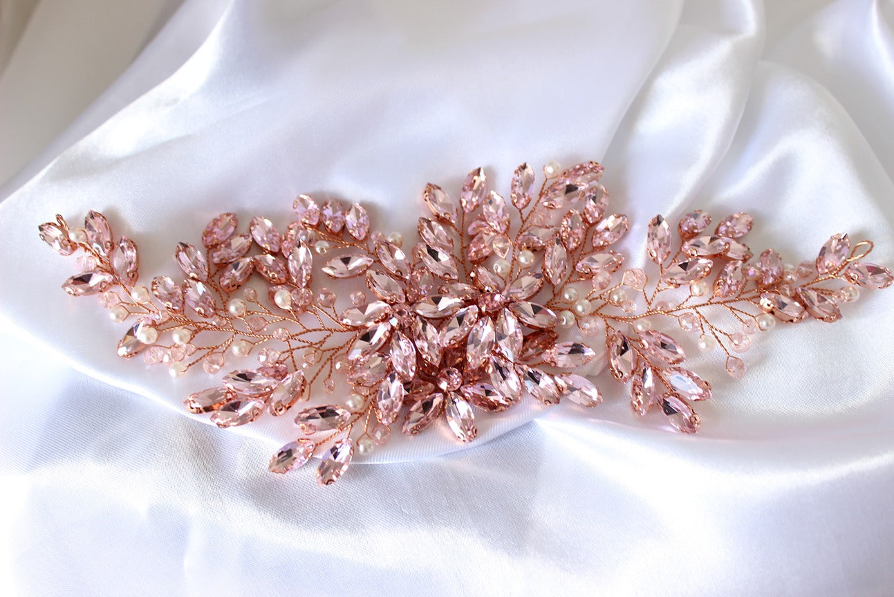 Pink bridal headpiece on white background