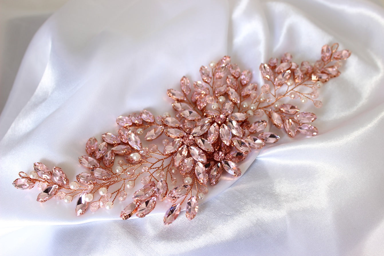 Pink bridal headpiece on white background