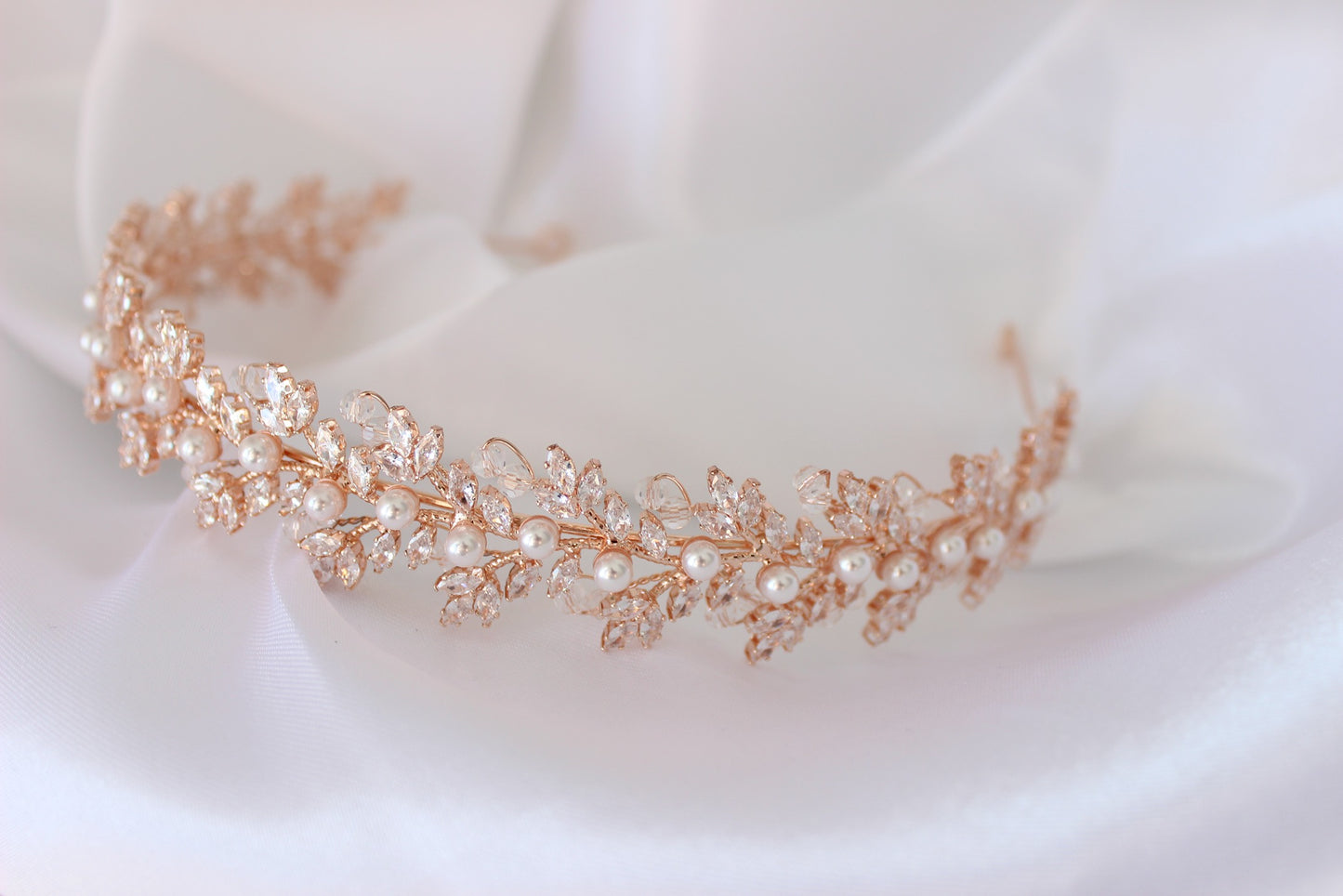 Rose gold bridal headband on white background