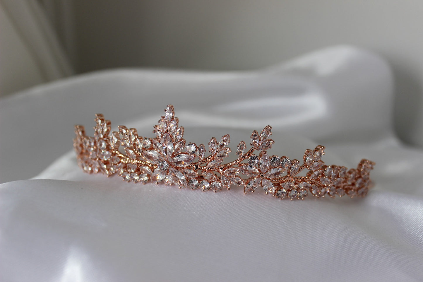 Rose gold bridal tiara on white background