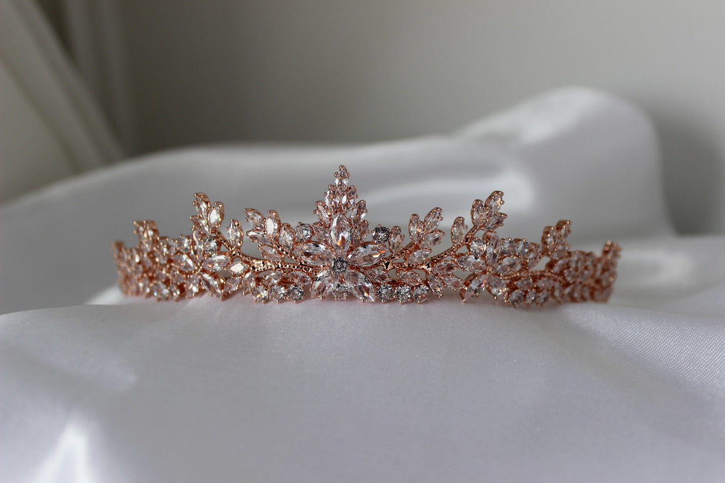 Rose gold bridal tiara on white background