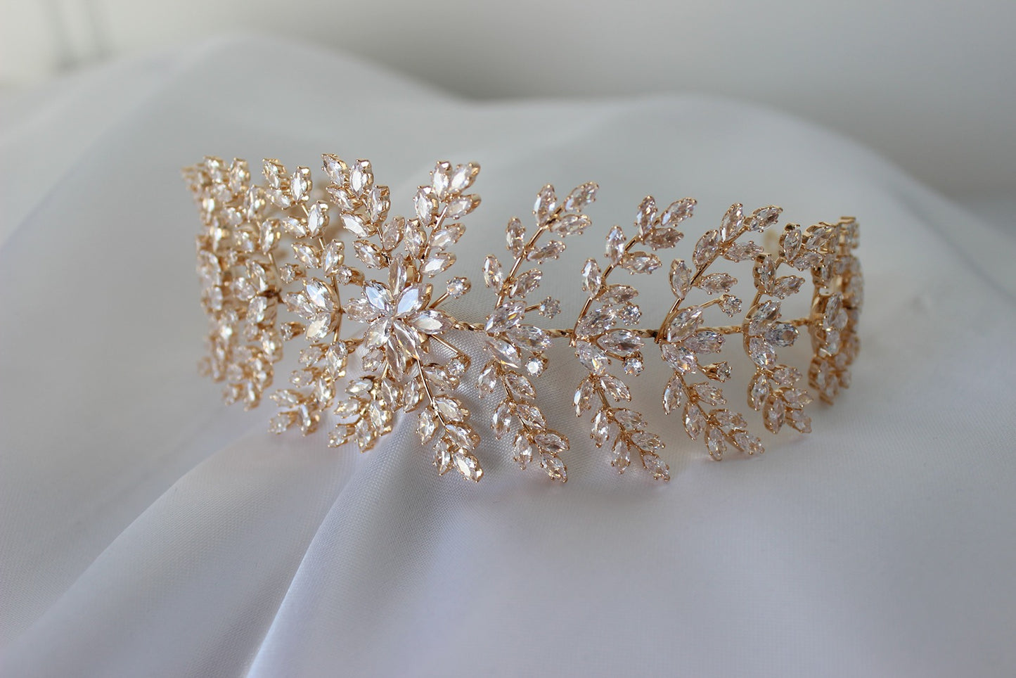 Rose gold headpiece on white background