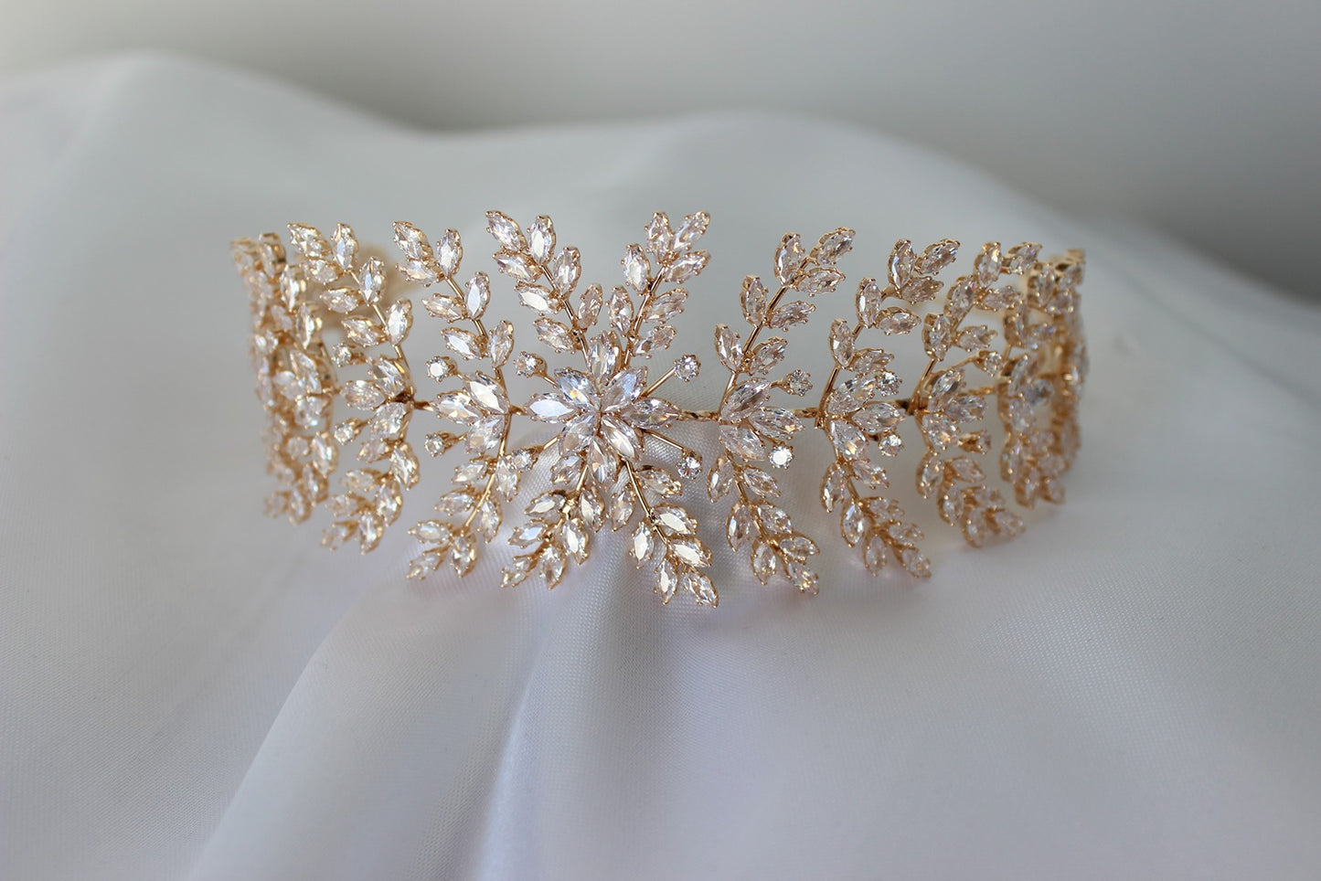 Rose gold headpiece on white background