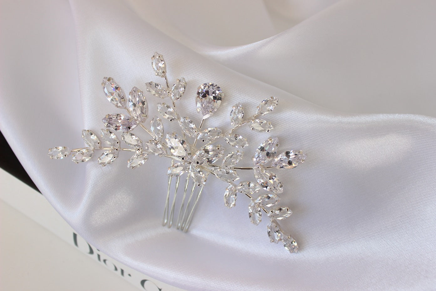 Silver hair pin on white background