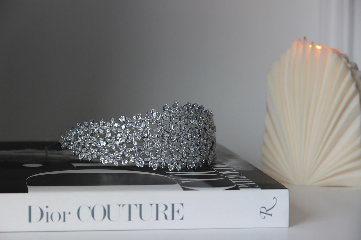 Silver bridal headband on dior book