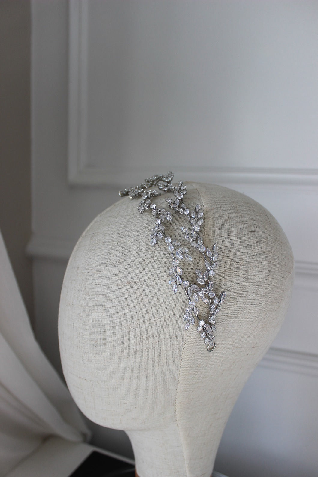 silver bridal headpiece on mannequin