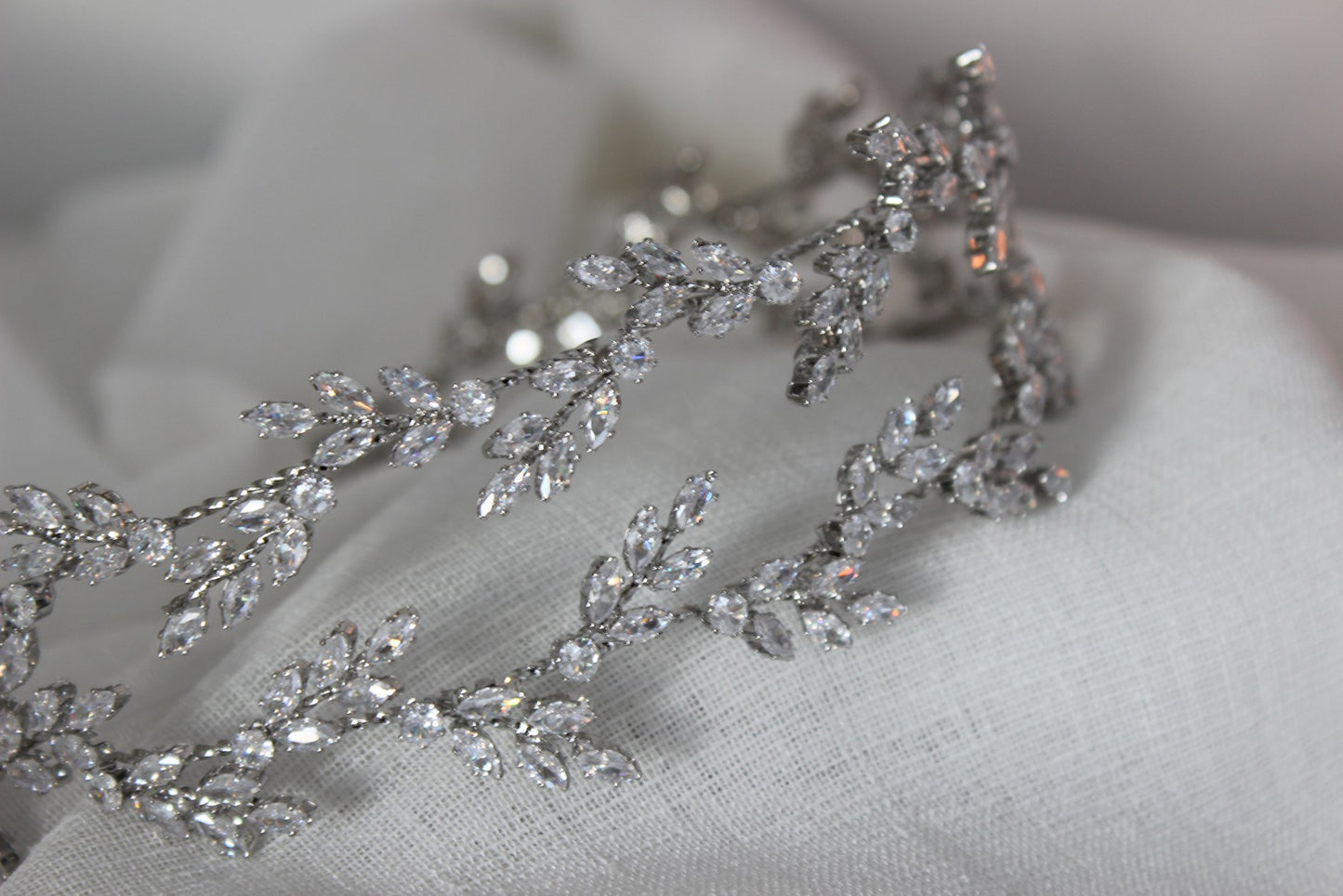 silver bridal headpiece on white background