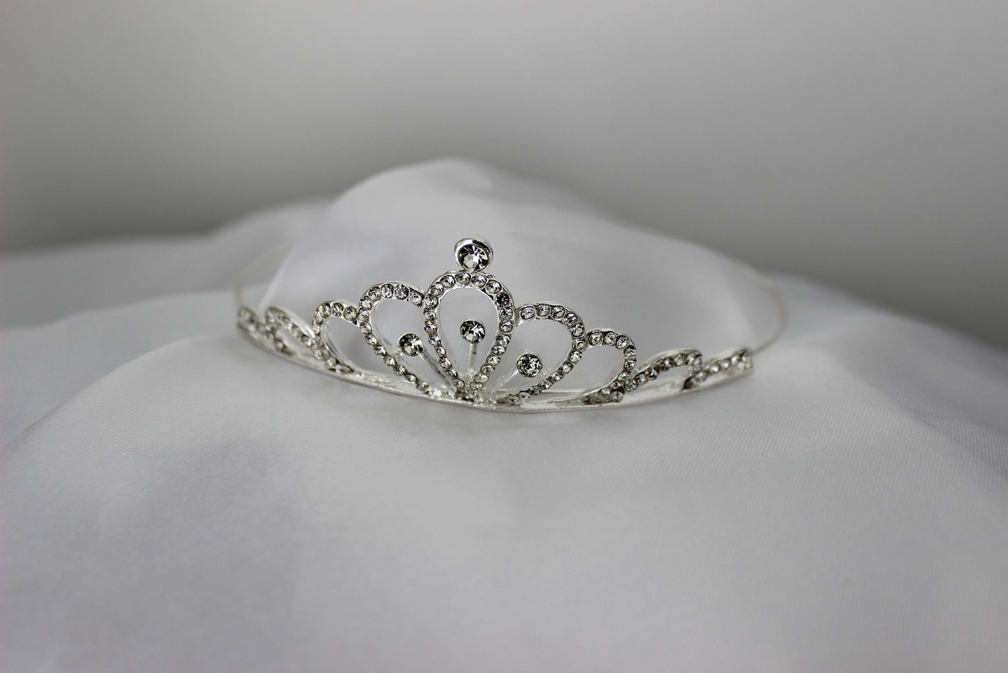 Silver flowergirl tiara on white background