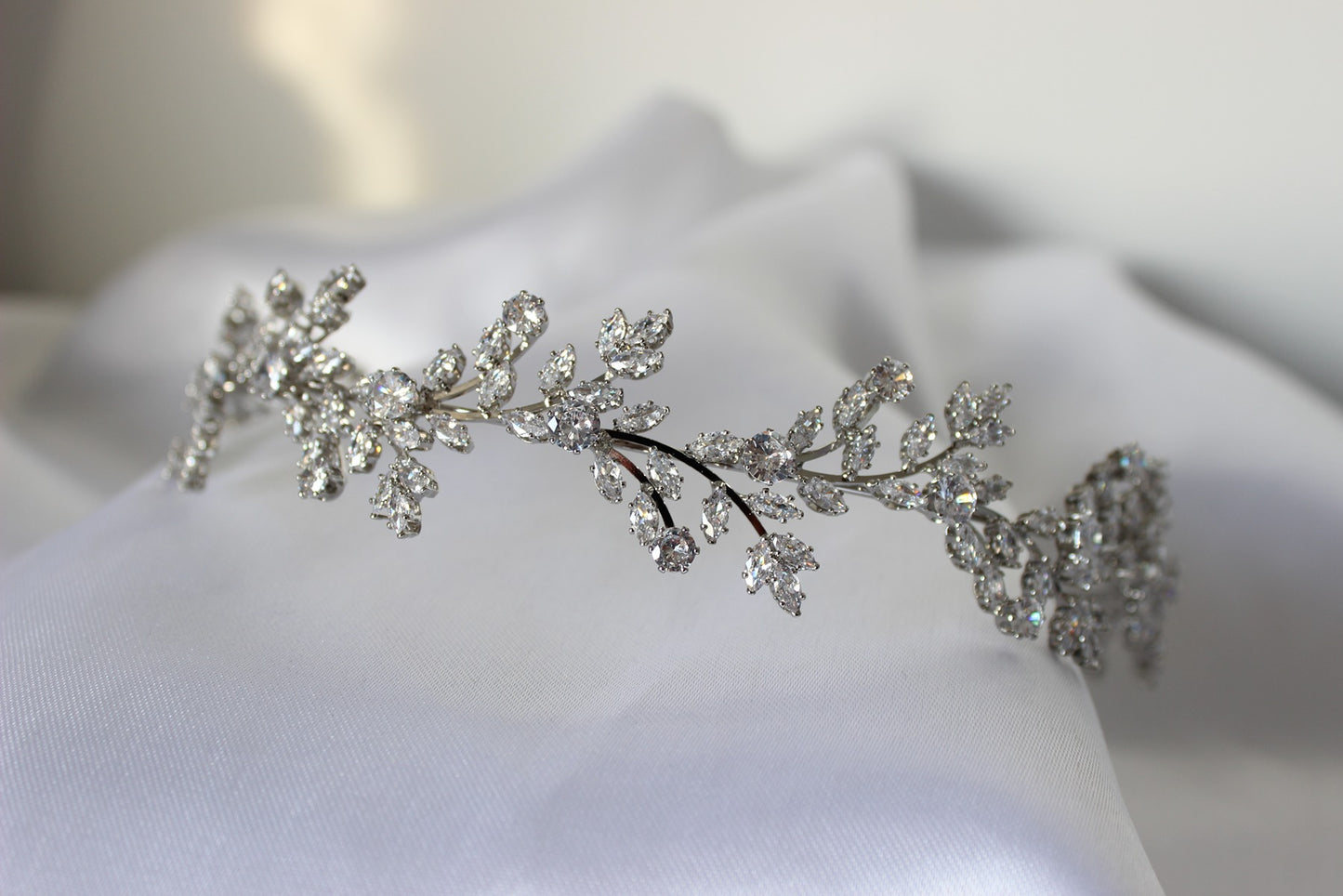silver headband on white background