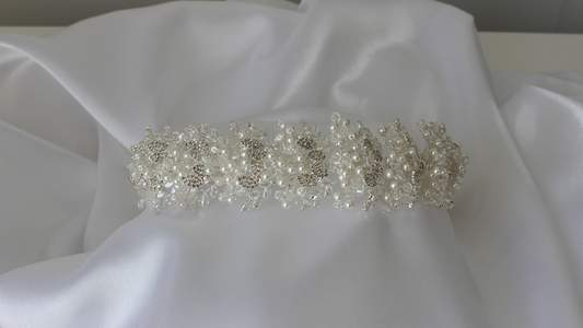 bridal crown on white silk background